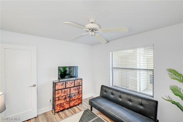 sitting room featuring ceiling fan and light hardwood / wood-style flooring