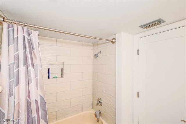 bathroom with shower / bathtub combination with curtain