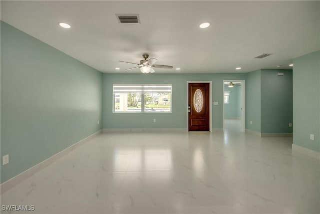 unfurnished living room featuring ceiling fan