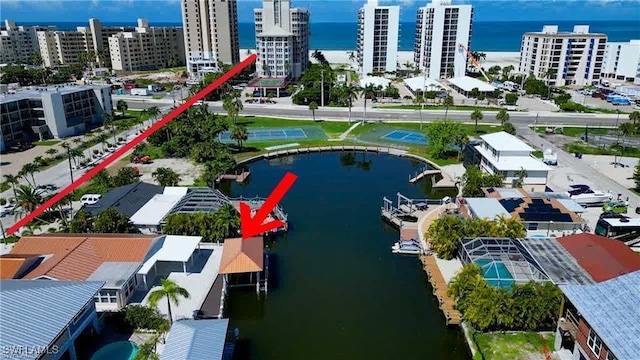 birds eye view of property with a water view