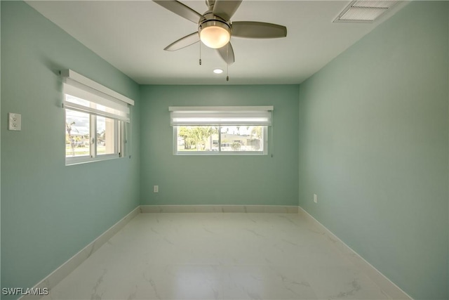 spare room with ceiling fan