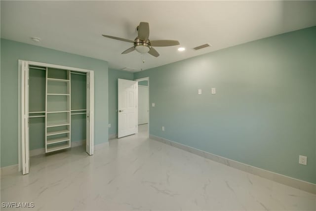 unfurnished bedroom featuring ceiling fan and a closet