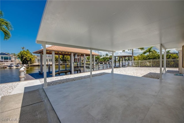 view of patio / terrace featuring a dock and a water view