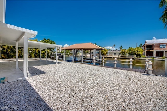 view of home's community featuring a water view and a dock