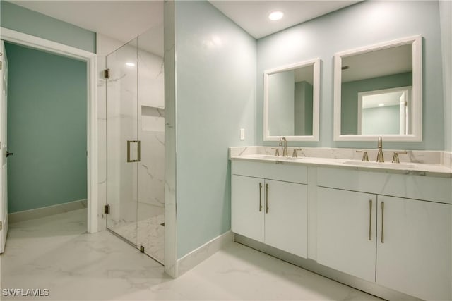 bathroom with vanity and a shower with shower door