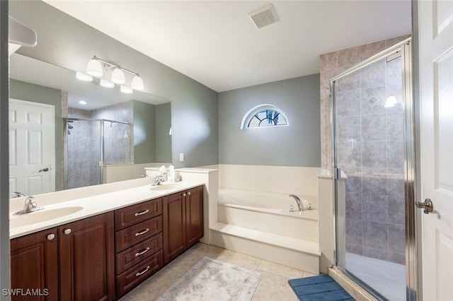 bathroom with vanity, tile patterned flooring, and independent shower and bath