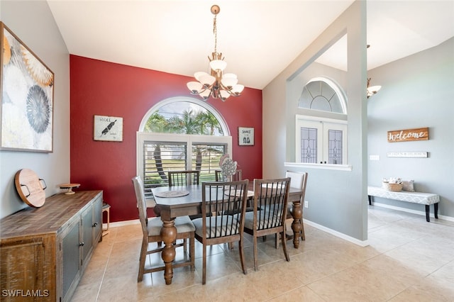 dining area featuring an inviting chandelier and light tile patterned floors