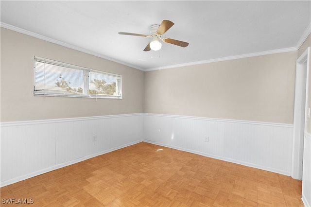 empty room featuring ceiling fan, light parquet floors, and crown molding