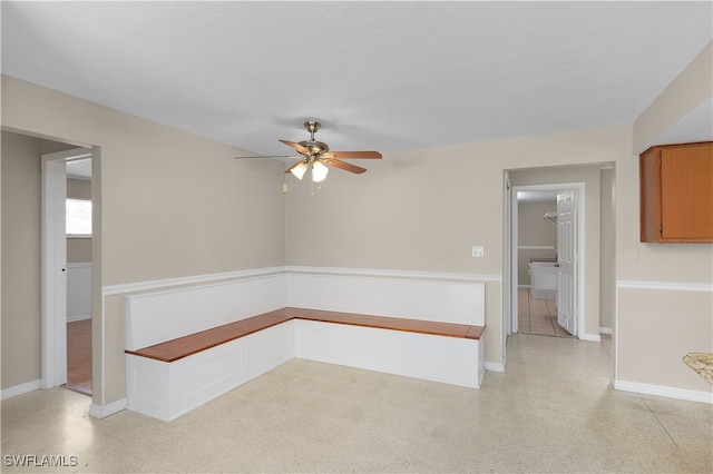 unfurnished room featuring ceiling fan