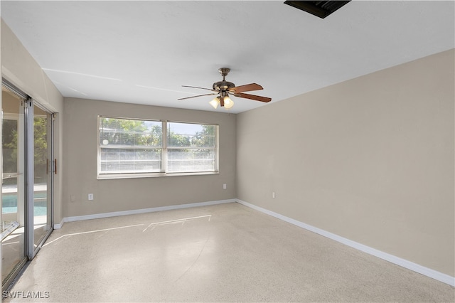 empty room featuring a healthy amount of sunlight and ceiling fan