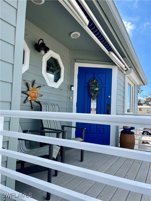 doorway to property featuring covered porch