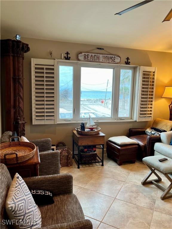 75 Friendship Ln, Englewood, FL 34223 - living area with light tile patterned floors