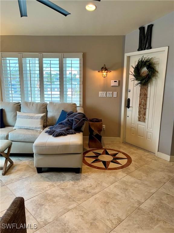 living room with recessed lighting and baseboards