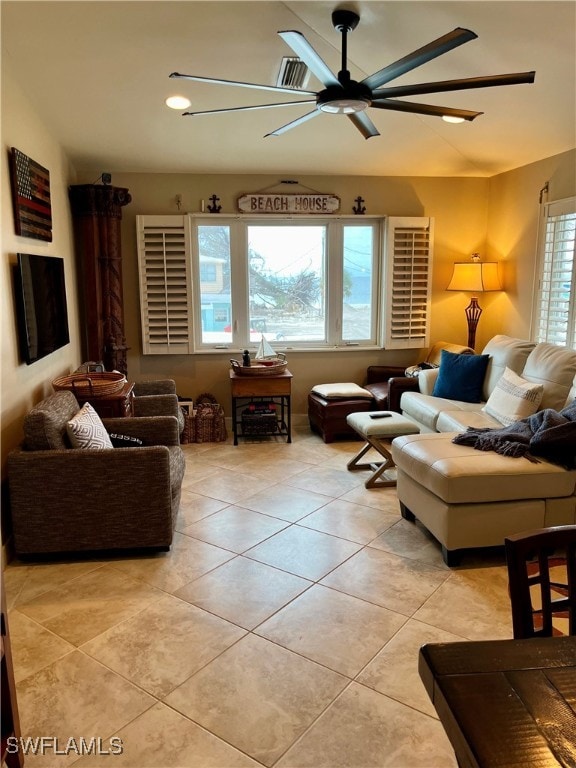 living room with ceiling fan and light tile patterned floors