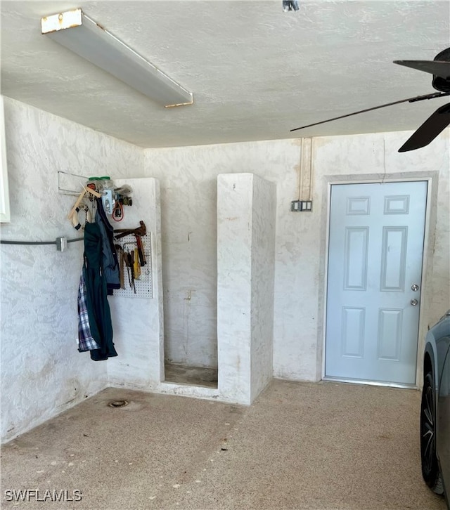 interior space featuring ceiling fan