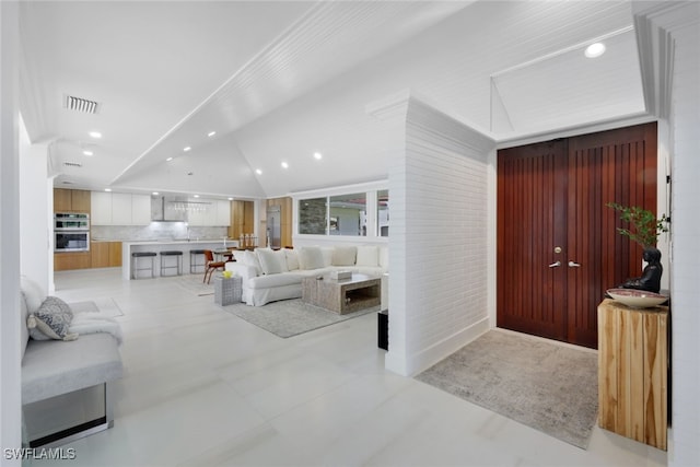 living room with vaulted ceiling