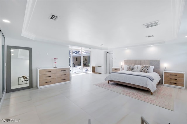 bedroom with a chandelier and a raised ceiling