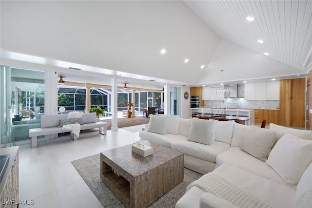 living room featuring high vaulted ceiling and wood ceiling