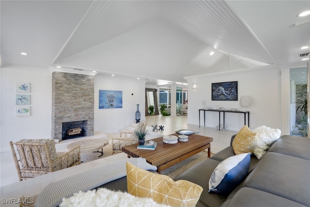 living room featuring a fireplace and vaulted ceiling