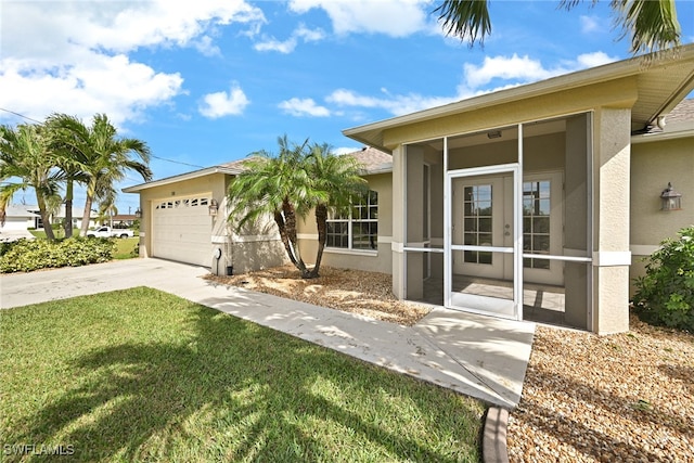 ranch-style home with a garage and a front yard