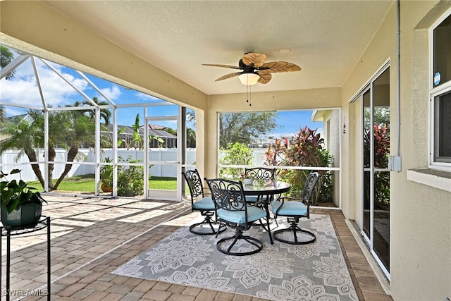 sunroom / solarium with ceiling fan