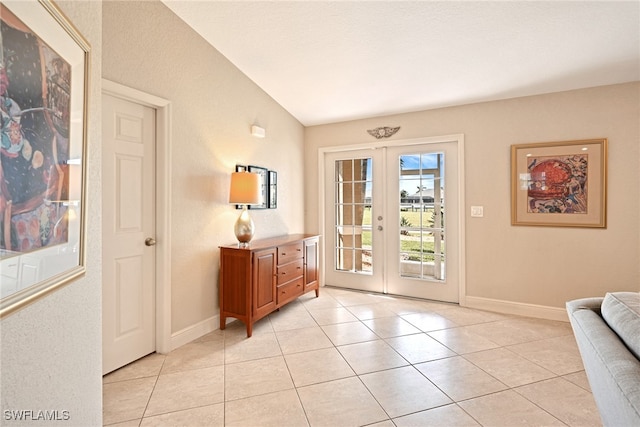 doorway to outside with french doors and light tile patterned floors