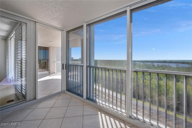 6849 Grenadier Blvd Unit 603, Naples, FL 34108 - unfurnished sunroom with a water view