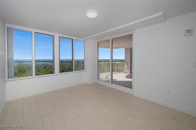 6849 Grenadier Blvd Unit 603, Naples, FL 34108 - unfurnished sunroom with wood finished floors and baseboards