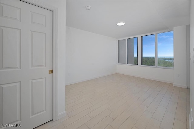 6849 Grenadier Blvd Unit 603, Naples, FL 34108 - unfurnished room featuring baseboards and a smoke detector
