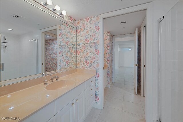 6849 Grenadier Blvd Unit 603, Naples, FL 34108 - full bath featuring wallpapered walls, tile patterned floors, vanity, and a shower