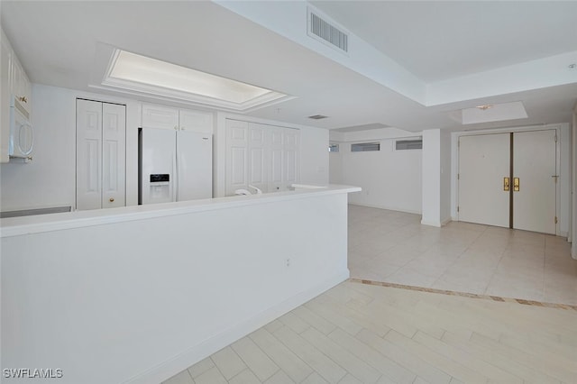 6849 Grenadier Blvd Unit 603, Naples, FL 34108 - empty room with a raised ceiling, light tile patterned floors, and baseboards