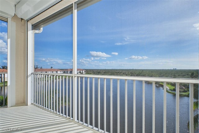 balcony featuring a water view