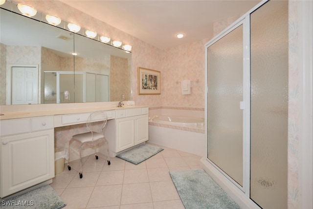 bathroom with vanity, tile patterned flooring, and plus walk in shower