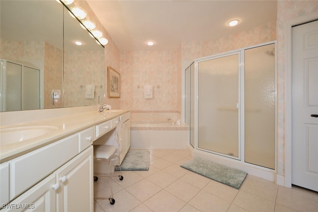 bathroom with shower with separate bathtub, vanity, and tile patterned floors