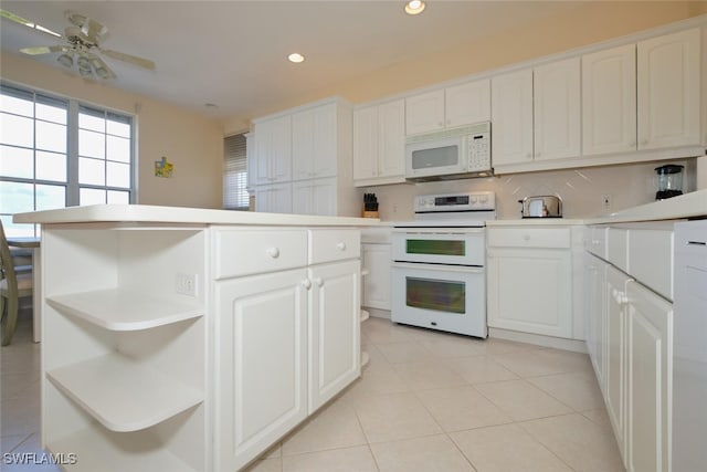 kitchen featuring white cabinets, white appliances, ceiling fan, and light tile patterned floors