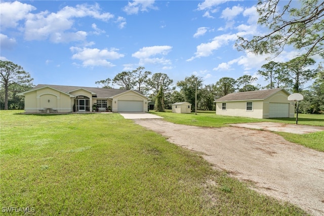 ranch-style home featuring a front lawn and a garage