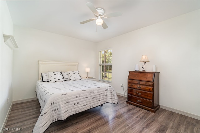 bedroom featuring ceiling fan and dark hardwood / wood-style flooring