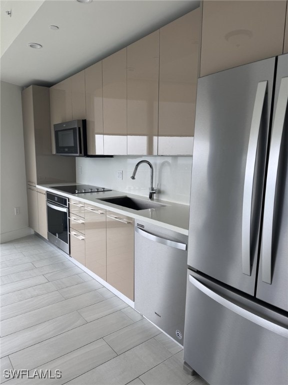 2000 Metropica Way Unit 1704, Sunrise, FL 33326 - kitchen featuring stainless steel appliances, a sink, modern cabinets, and light countertops