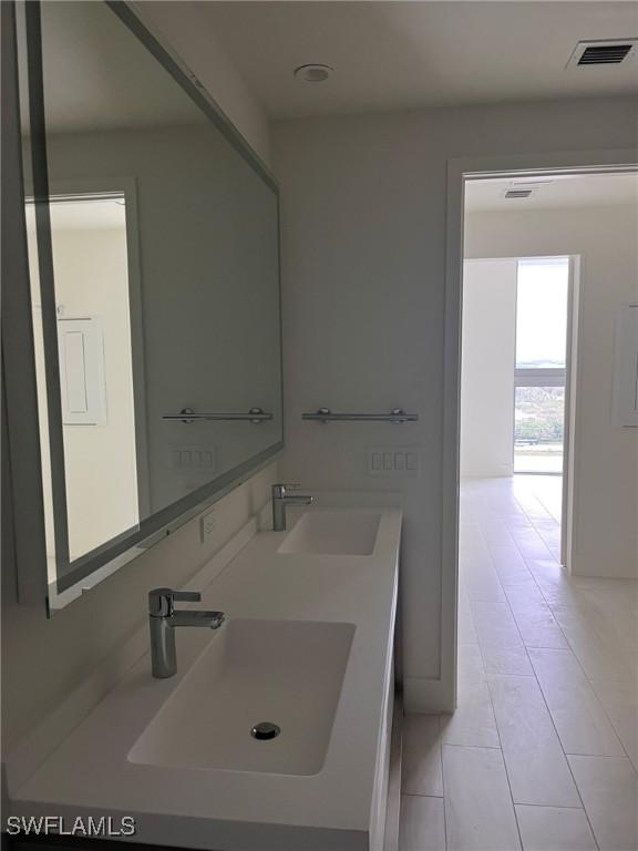 2000 Metropica Way Unit 1704, Sunrise, FL 33326 - bathroom with tile patterned flooring and double vanity