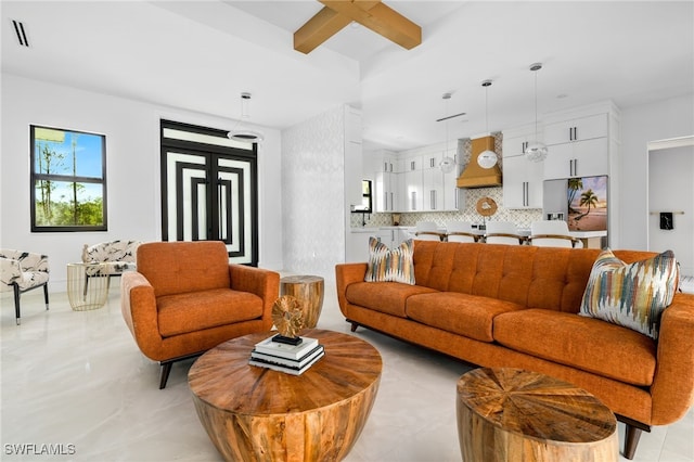 living room featuring beamed ceiling