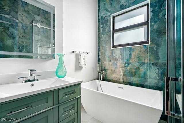 bathroom with a tub to relax in and vanity