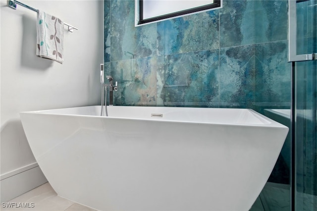 bathroom featuring a bathtub and tile patterned flooring