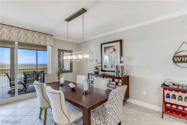 tiled dining room featuring ornamental molding