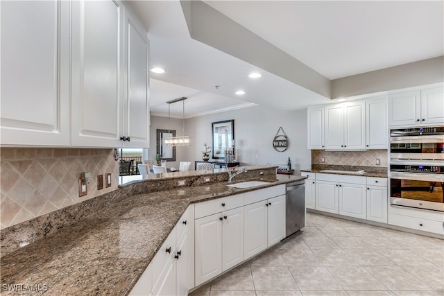 kitchen featuring appliances with stainless steel finishes and white cabinets