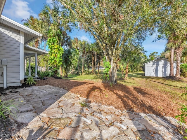 view of patio / terrace with an outbuilding