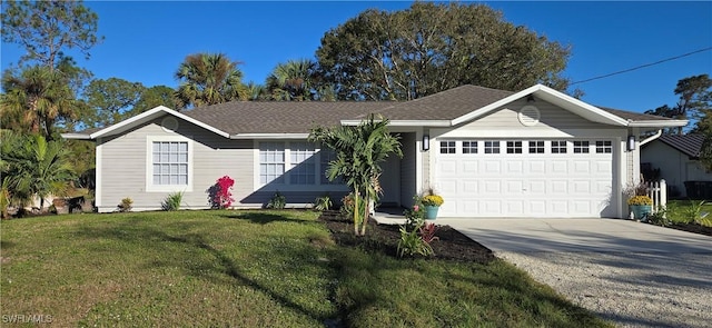 ranch-style house with a front yard and a garage