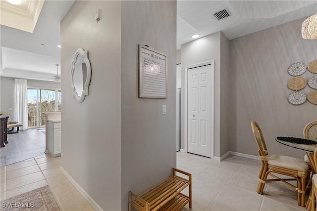 hall with light tile patterned flooring