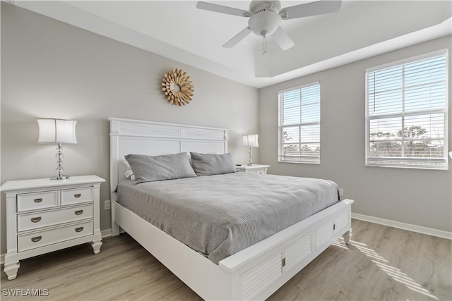 bedroom featuring light hardwood / wood-style floors and ceiling fan