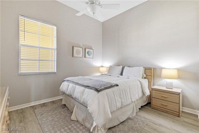 bedroom with light wood-type flooring and ceiling fan