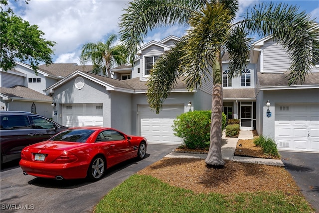 townhome / multi-family property featuring a garage